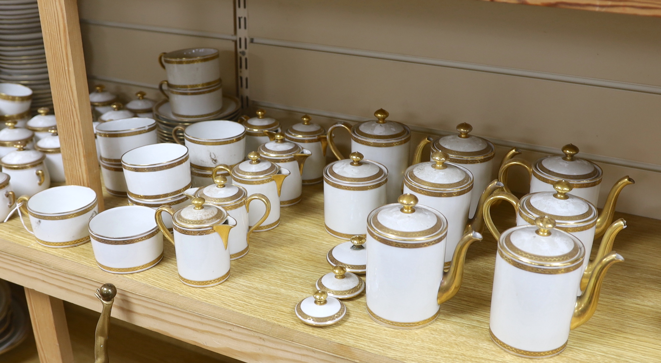 Three French Limoges gilt banded part dinner and tea services including cups, plates and jars & covers